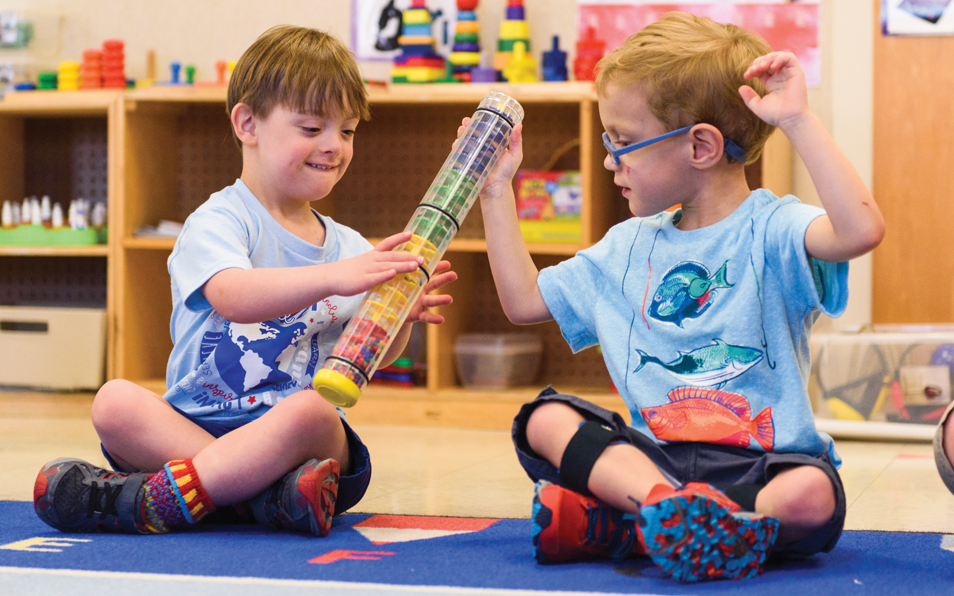Two RISE students playing in class