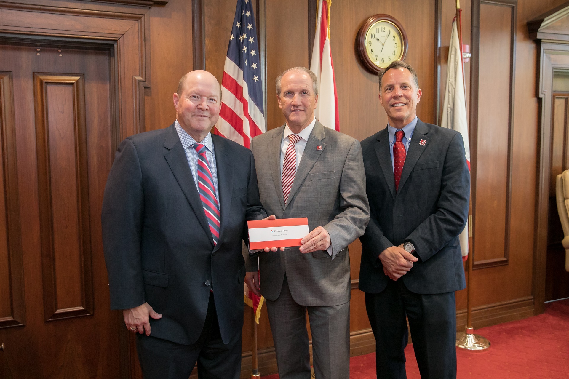 Mark Crews, of Alabama Power, makes a presentation to UA President Stuart R. Bell and Dr. Russell Mumper.