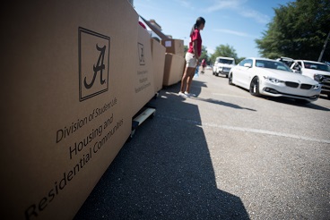 Student with moving boxes during move-in day
