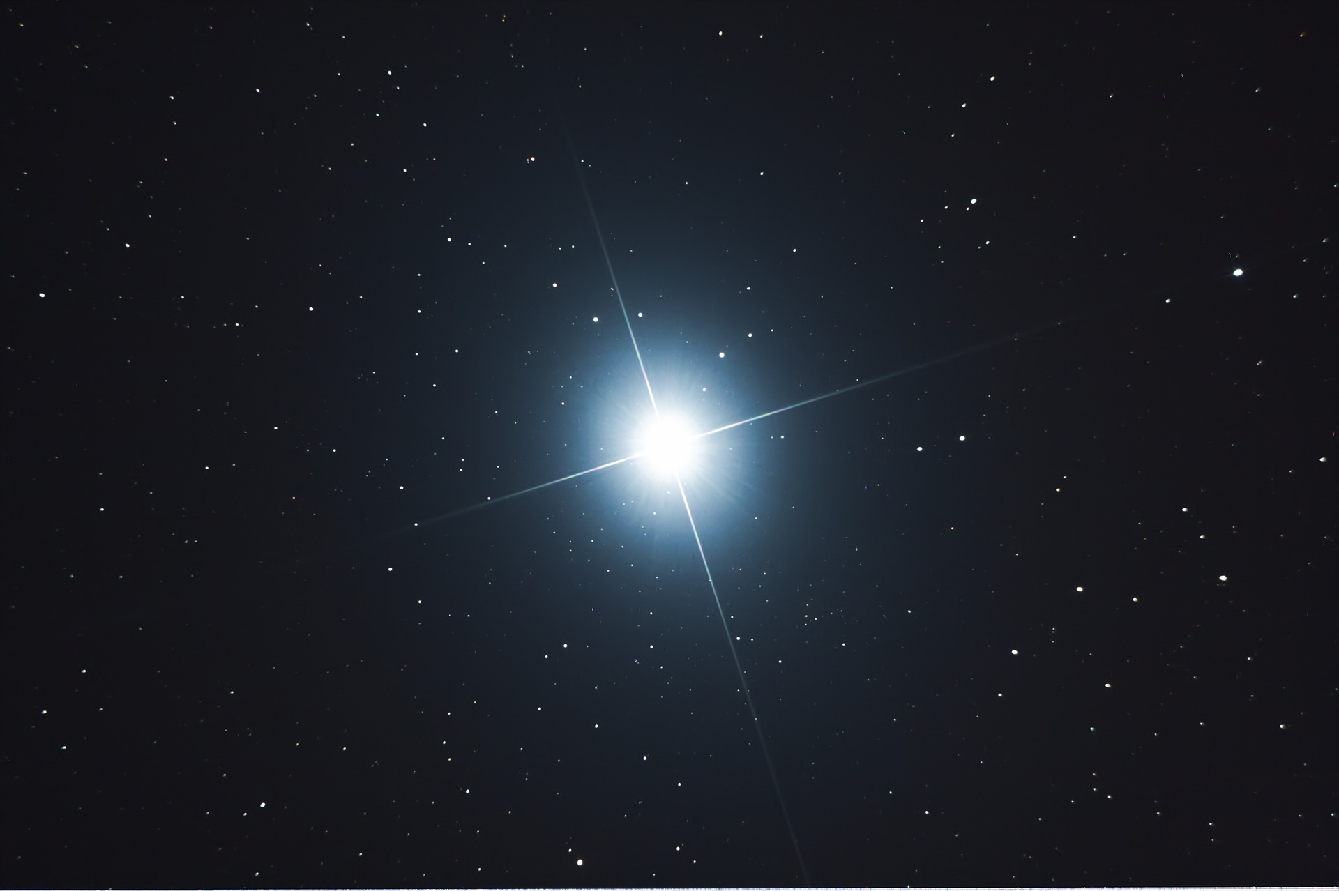 The star Sirius shines brightly in the night sky.