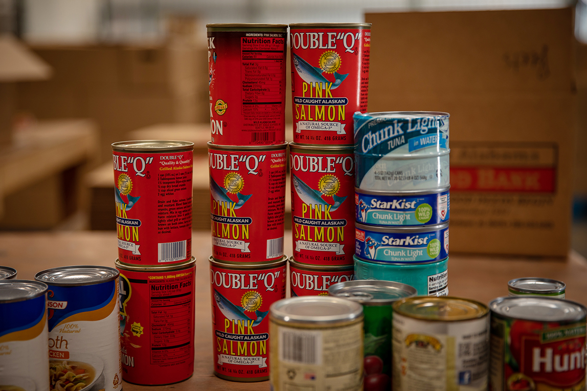 A stack of canned food symbolizes Beat Auburn Beat Hunger.