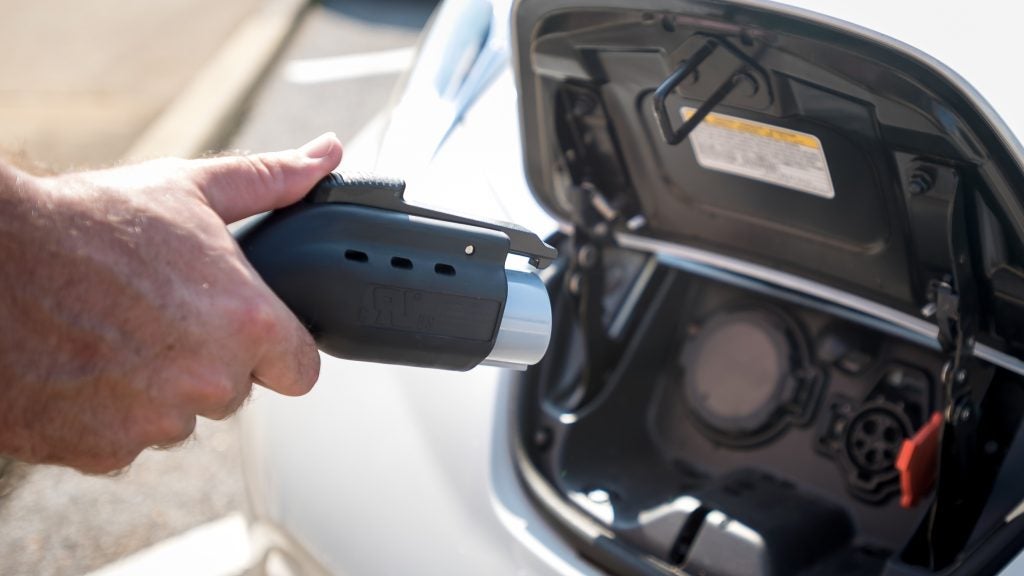 Electric car being charged on campus