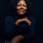 Author Honoree Fanonne Jeffers standing against black background