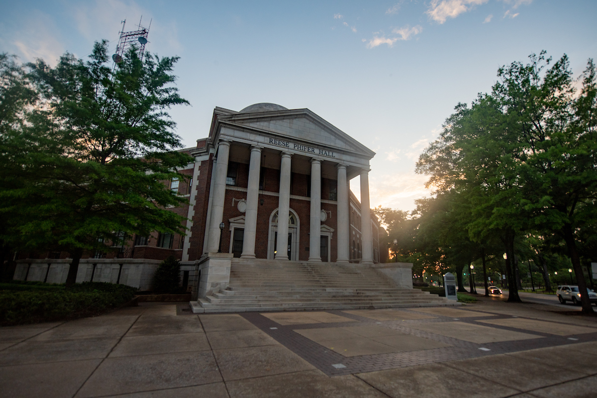 The sun sets over Reese Phifer Hall.