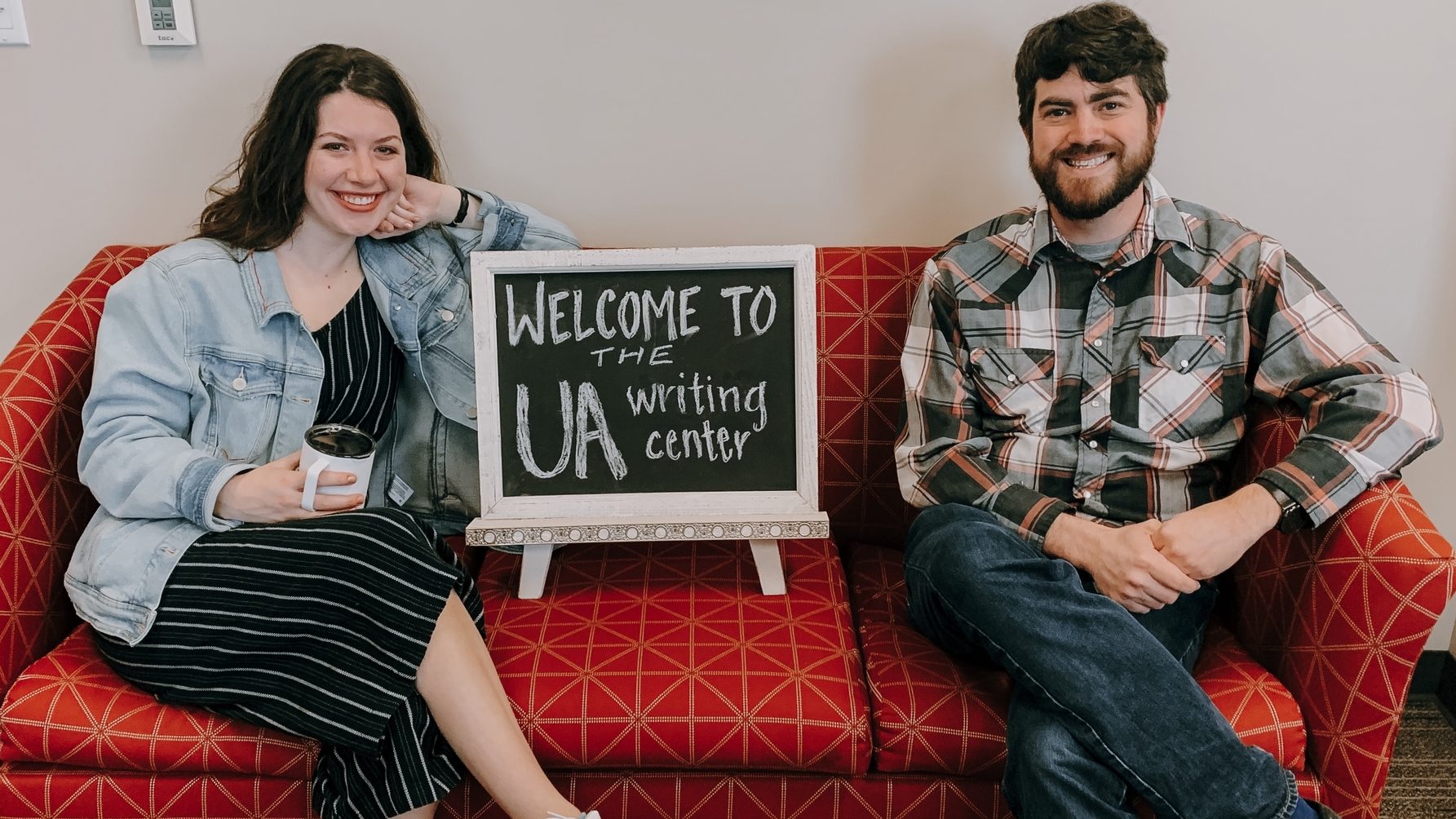 UA Writing Center posed photo on couch