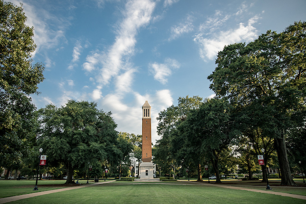 The summer sun sets on the quad with Denny Chimes.