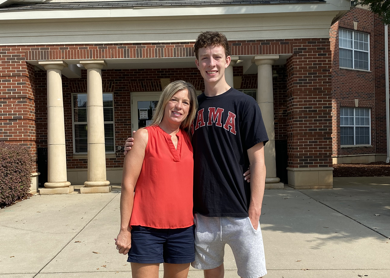 A mom and her freshman son in front of Riverside East.