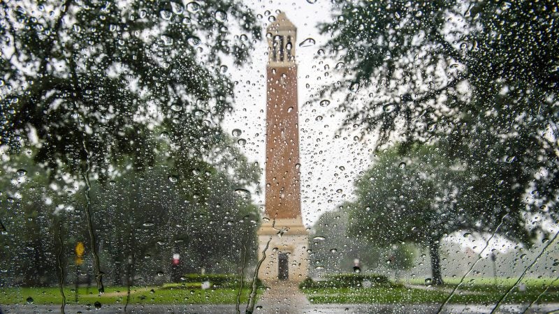 Denny Chimes through rain on a window