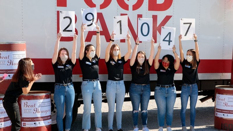 Beat Auburn Beat Hunger student organizers reveal the results of the food drive.