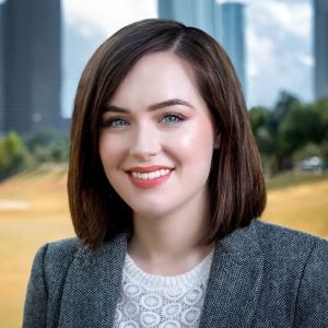 Portrait of woman in business suit smiling.