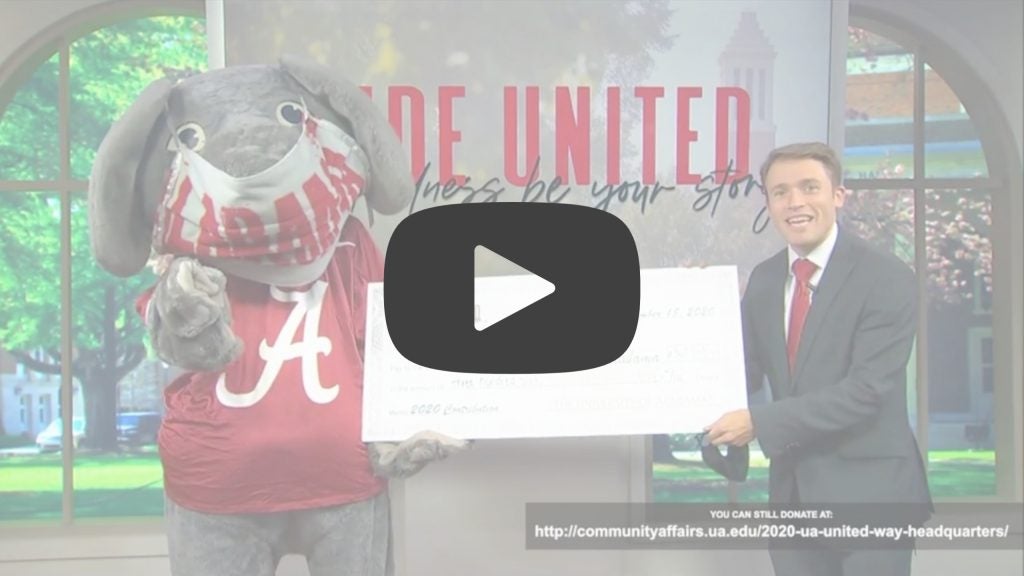 Dr. Adam Brooks with Big Al and a big check