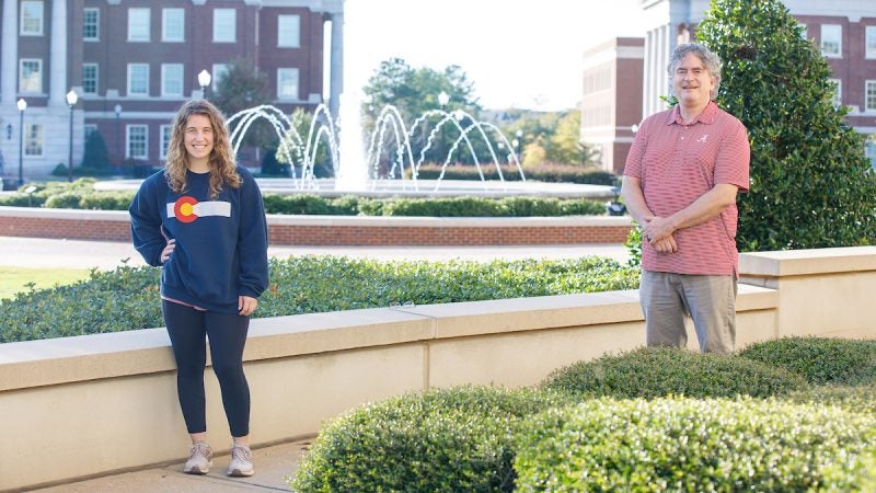 Mary Virginia McKinley stands with Dr. Gray six feet apart beside the fountains