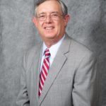 Bill Cummins wearing a gray suit