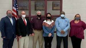 West Blocton, Alabama's mayor and five city council members pose for a photo.