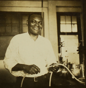 black and white photograph of Sam May in a UA chemistry lab