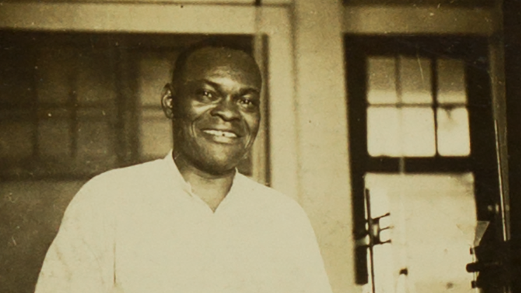 black and white photograph of Sam May in a UA chemistry lab