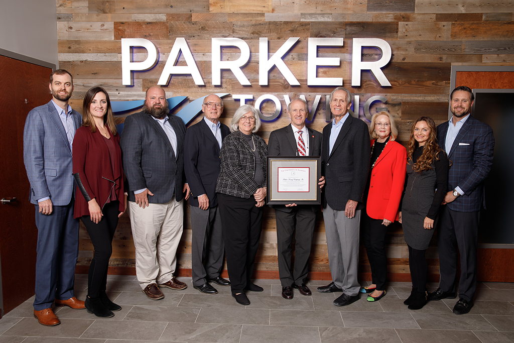 A photo of UA President Dr. Stuart Bell and members of the Parker and Haun families.
