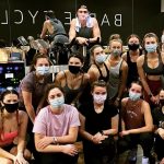 a group of women wearing masks after a barre cycle class