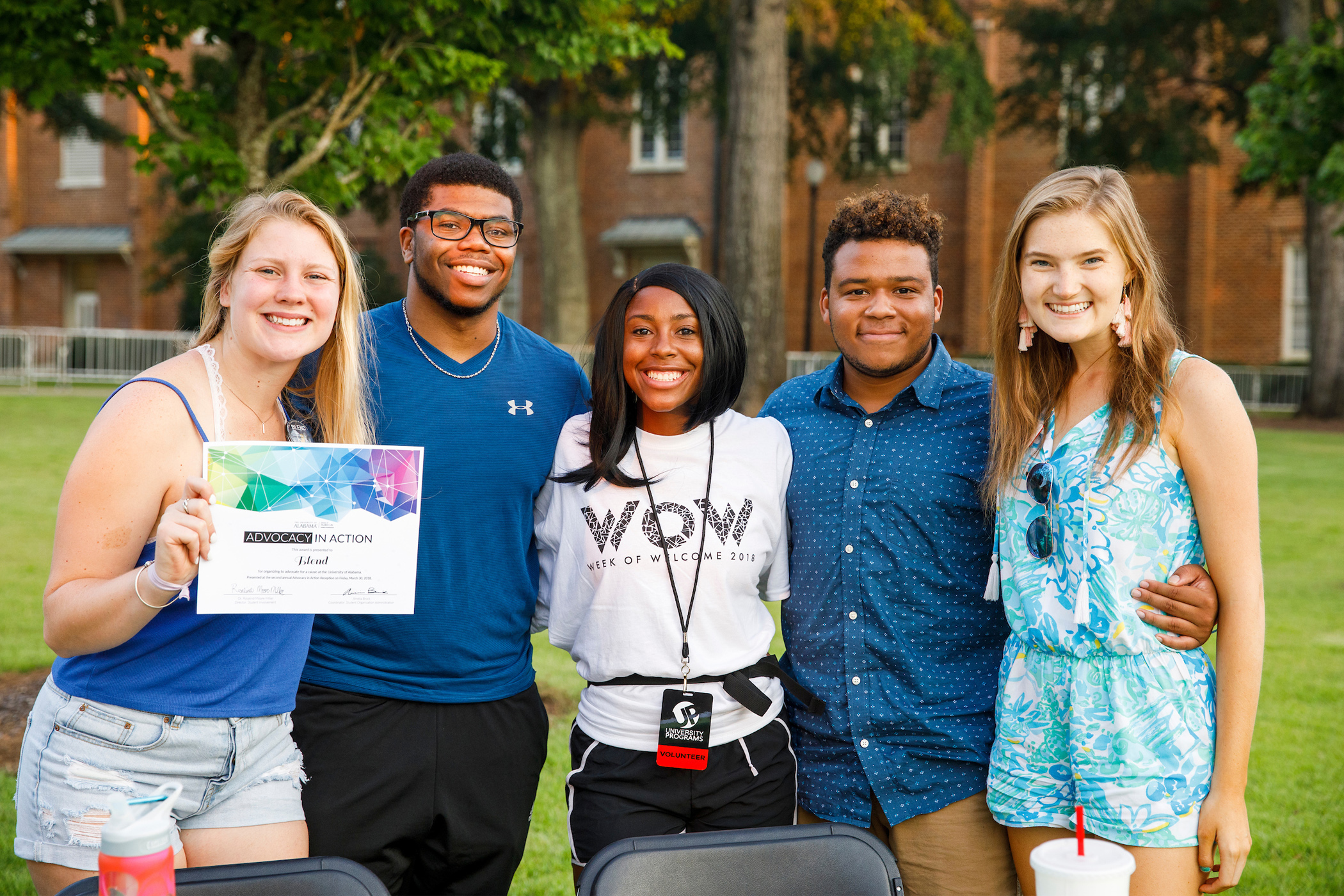 Five students posing for a photo during a past Weeks of Welcome event