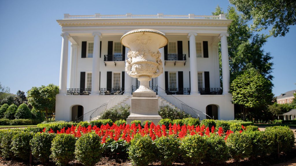 photograph of the flower beds and fountain in front of the President's Mansion