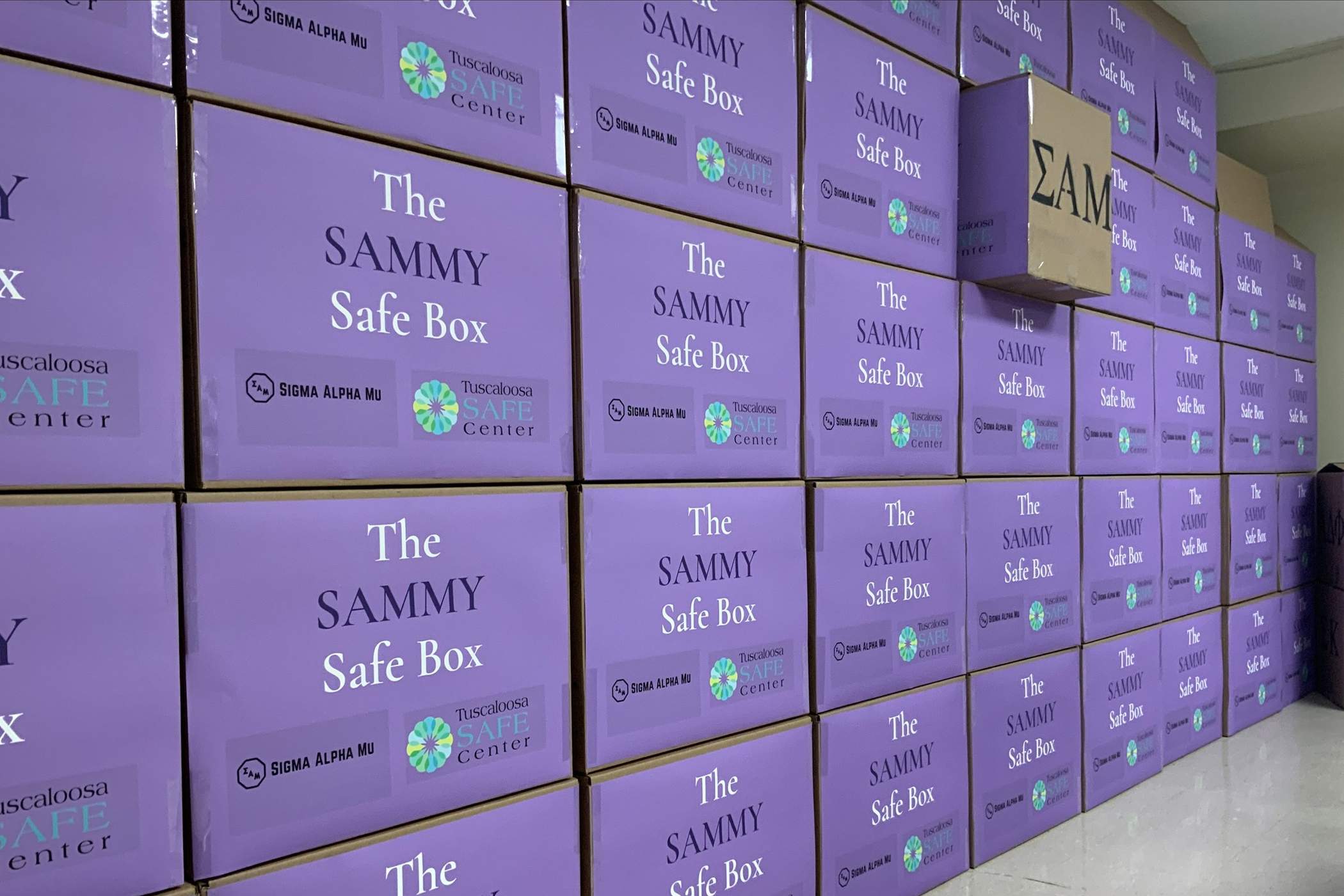 Numerous Sammy Safe Boxes stacked in a room