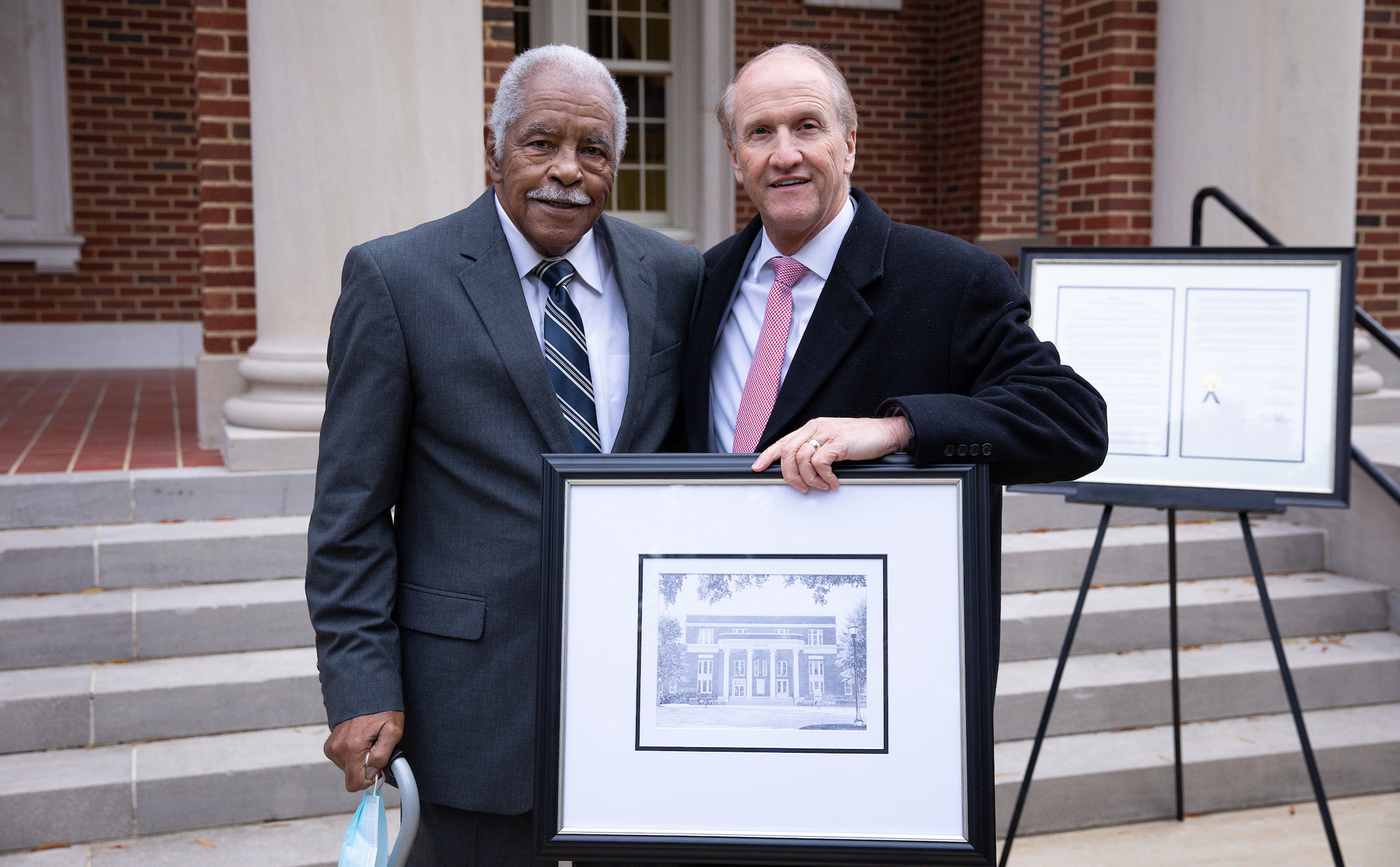 Archie Wade and Stuart Bell standing in front of Wade Hall following the dedication ceremony