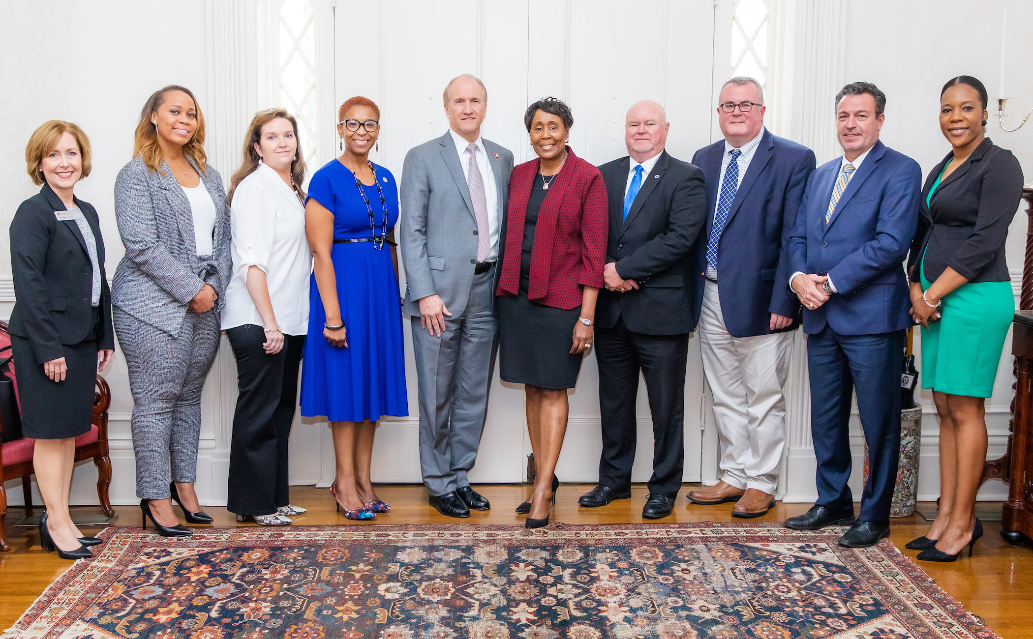 President Stuart Bell and community college leaders during the event at the President's Mansion