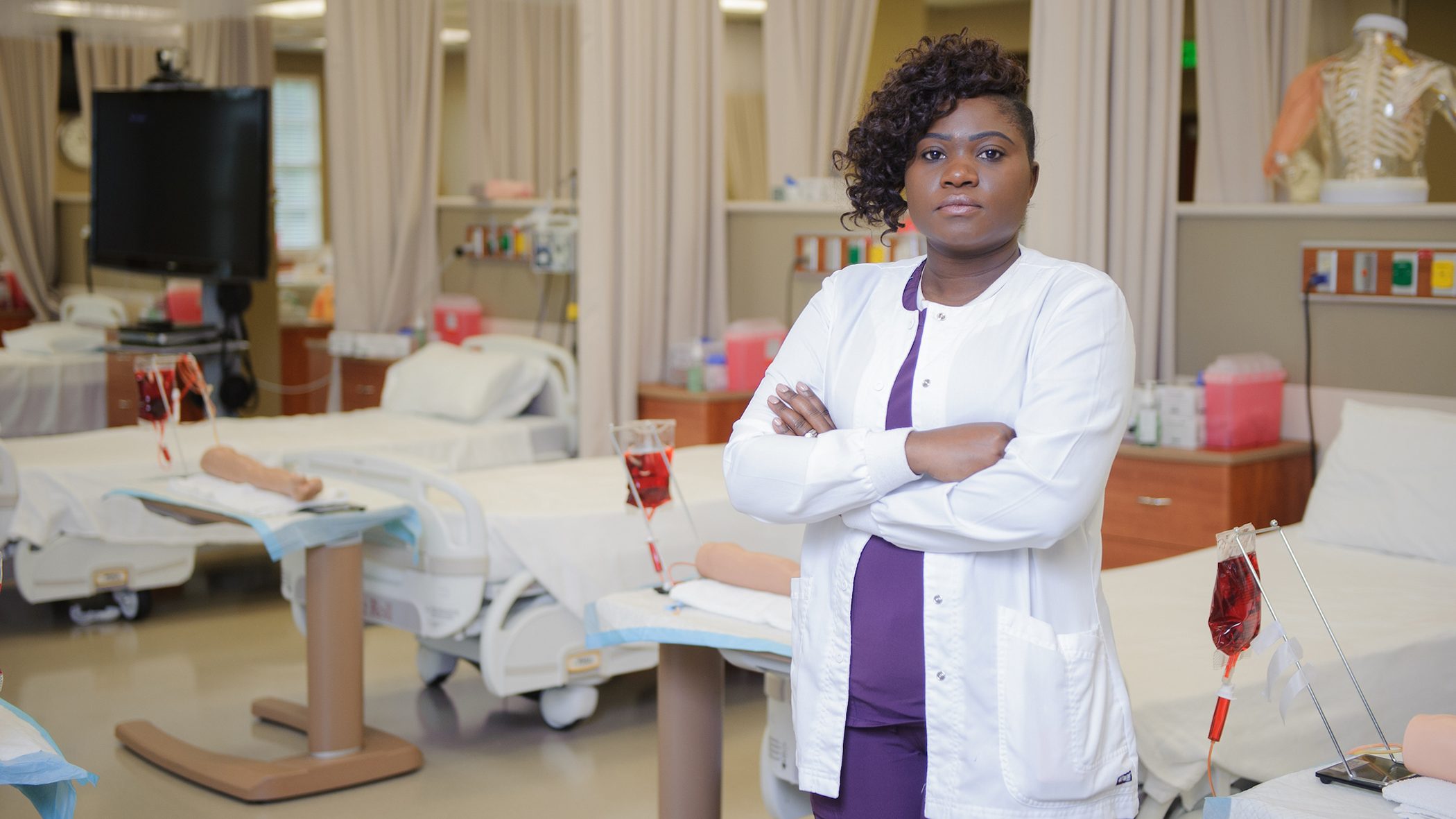 Mercy Mumba posing in a nursing lab