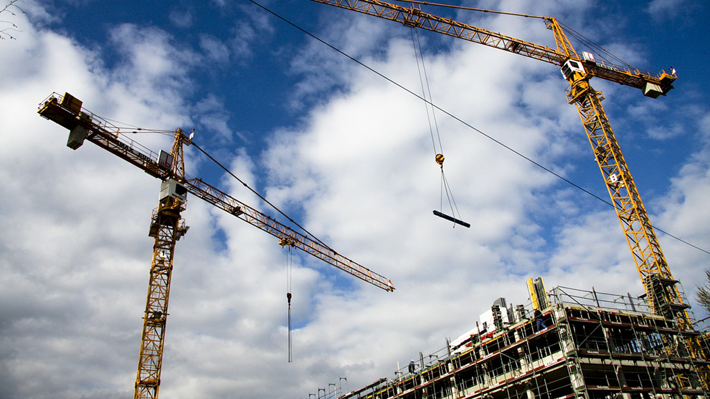 A construction site with cranes.