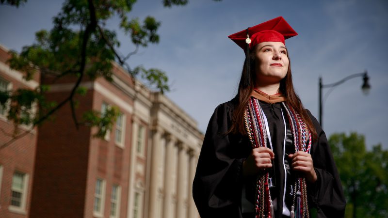 A University of Alabama graduate in cap and gown.