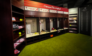 A set of lockers with softball equipment in them.