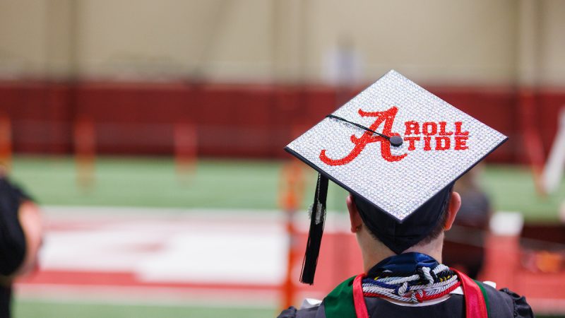 A mortar board for graduation decorated with a script A and "Roll Tide" on top.