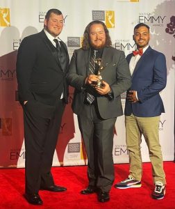 UA student Dawson Estes (left) and producers Will Green and Angel Caro of UA's Center for Public Television and Radio are pictured with their Southeast Emmy Award.