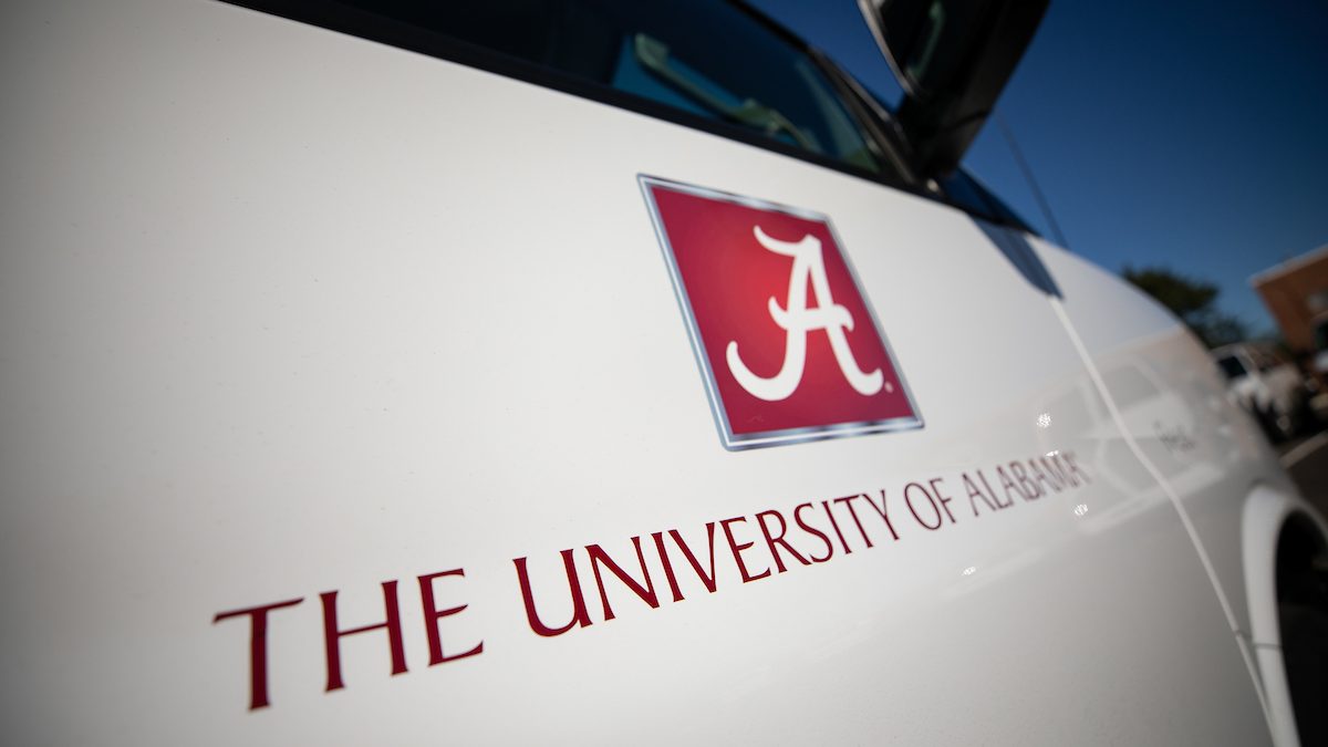 The University of Alabama logo on the door of a car.