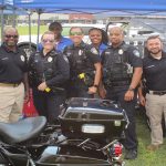 UA police officers and Security Resources Assistants pose for a photo.