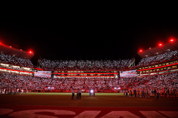 Bryant-Denny Stadium lit with crimson lights.
