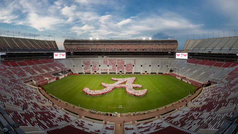 A large number of new students forming the Script A on the field of Bryant-Denny Stadium