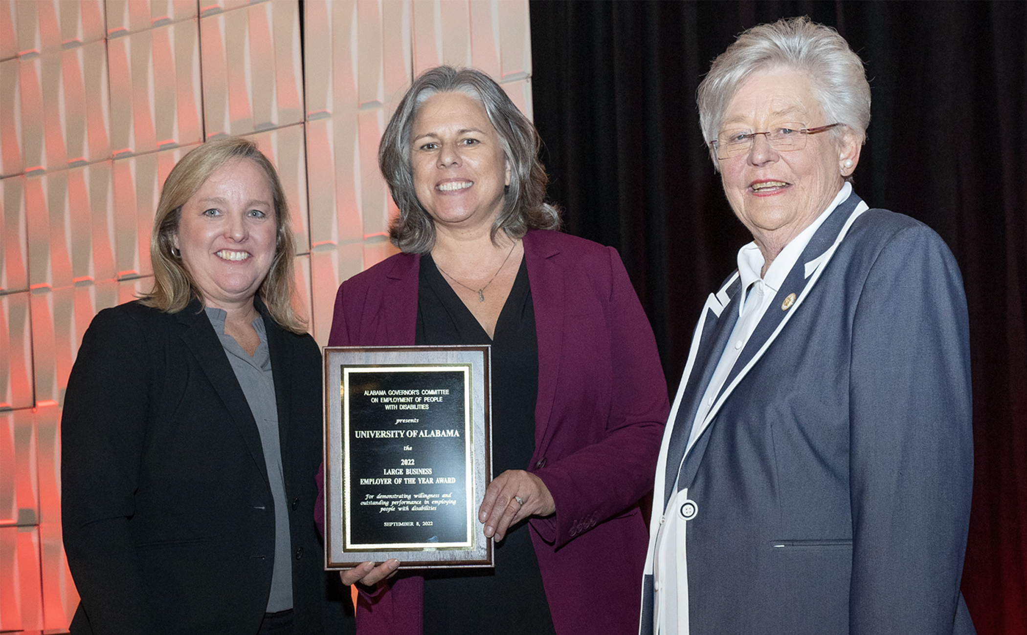 Jane Elizabeth Burdeshaw, Jaime Mitchell and Governor Kay Ivey pictured during an awards ceremony