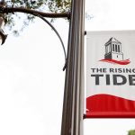 A banner that reads "The Rising Tide"
