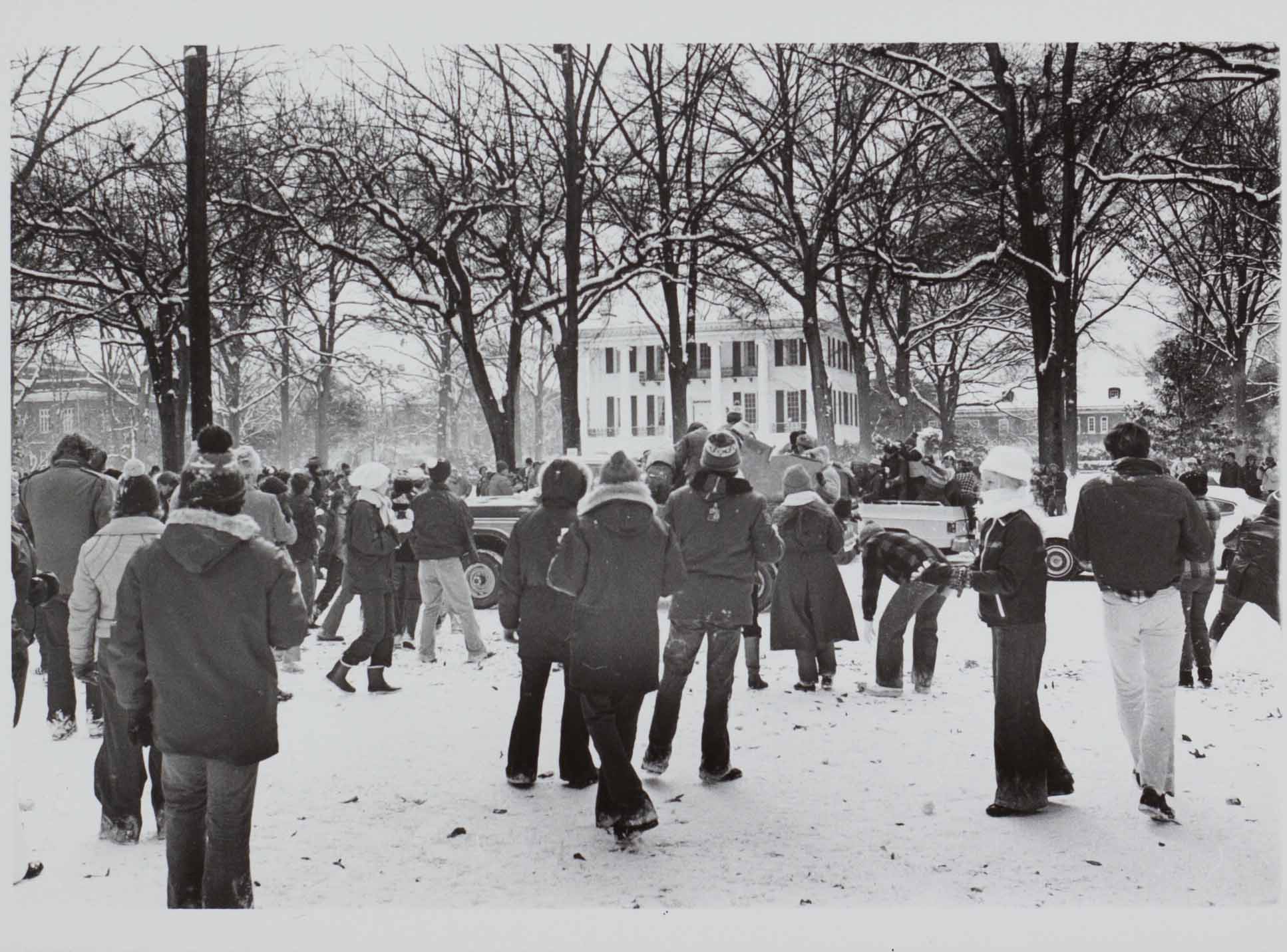 Students playing in snow in front of President's Mansion