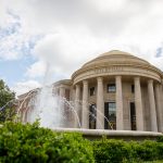 Shelby Hall at The University of Alabama with water fountain in foreground.