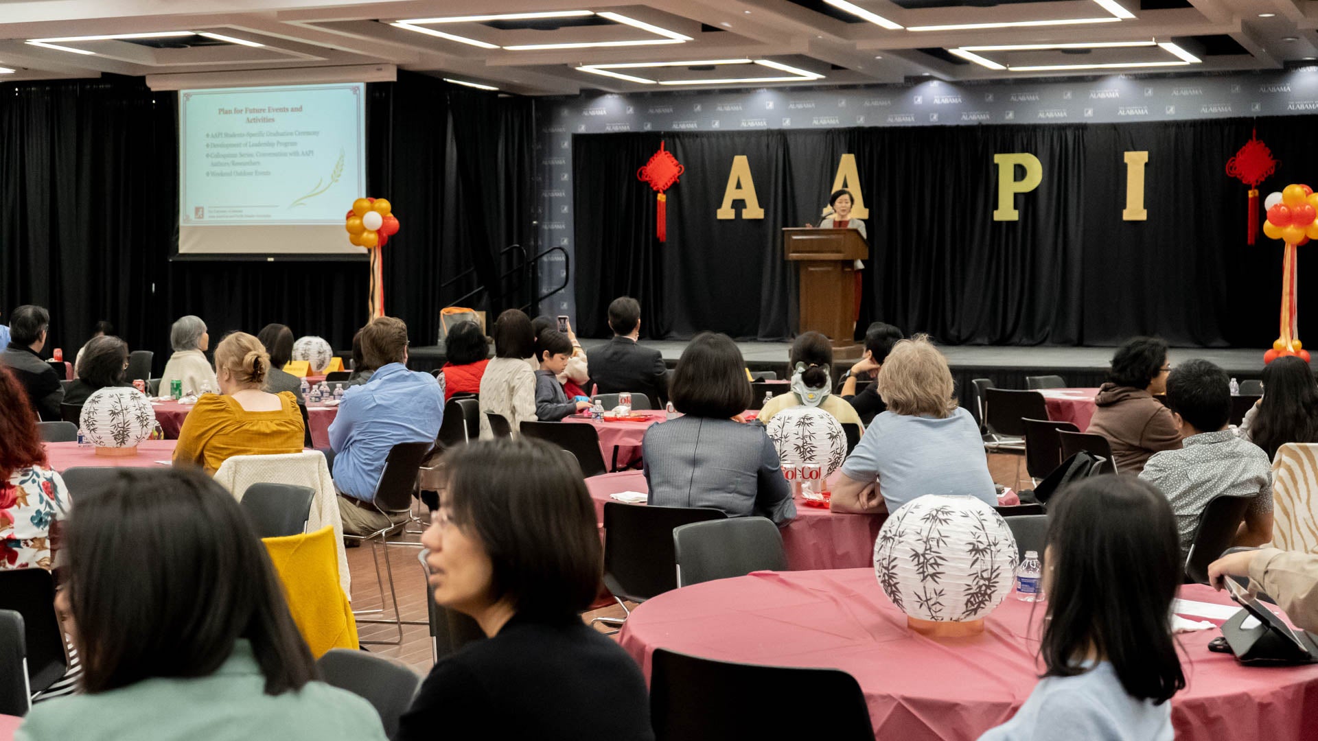 a speaker addresses a crowd