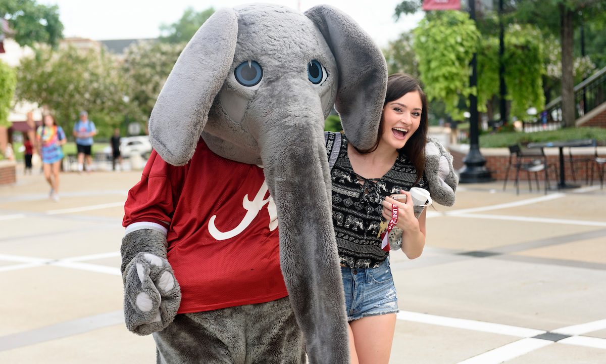 A woman poses with Big Al for a photo.