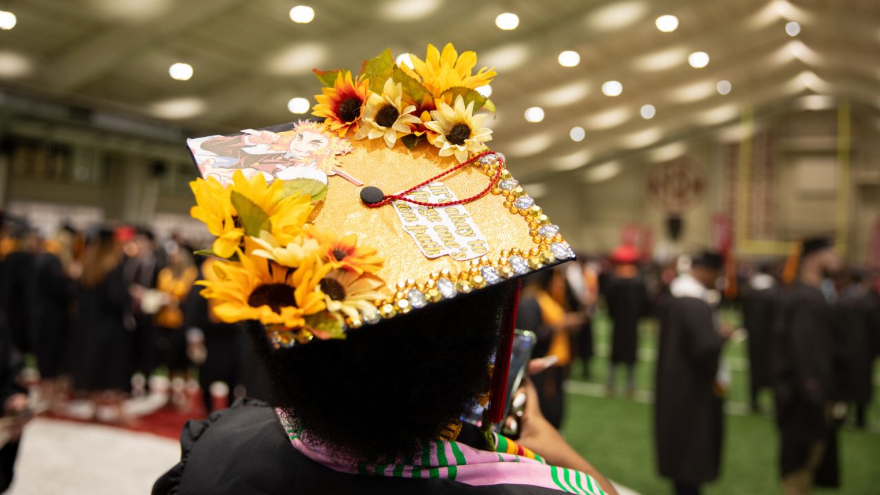a graduation cap decorated in sunflowers
