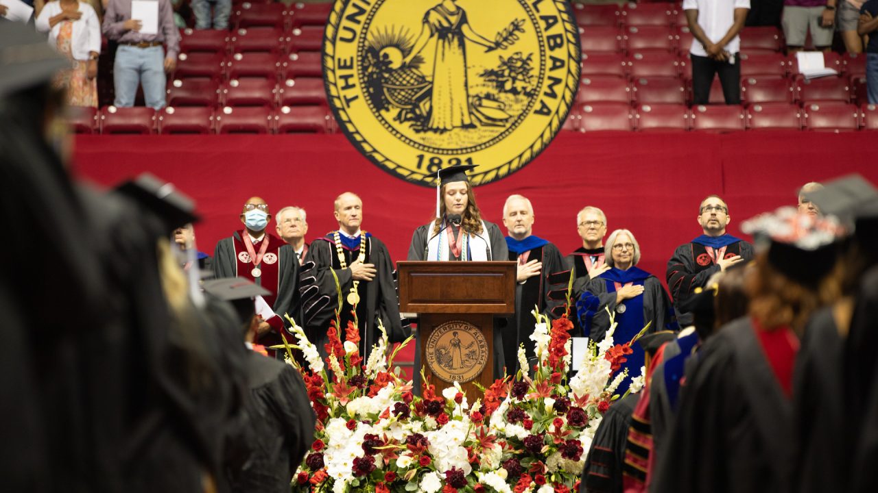 a speaker at the commencement podium