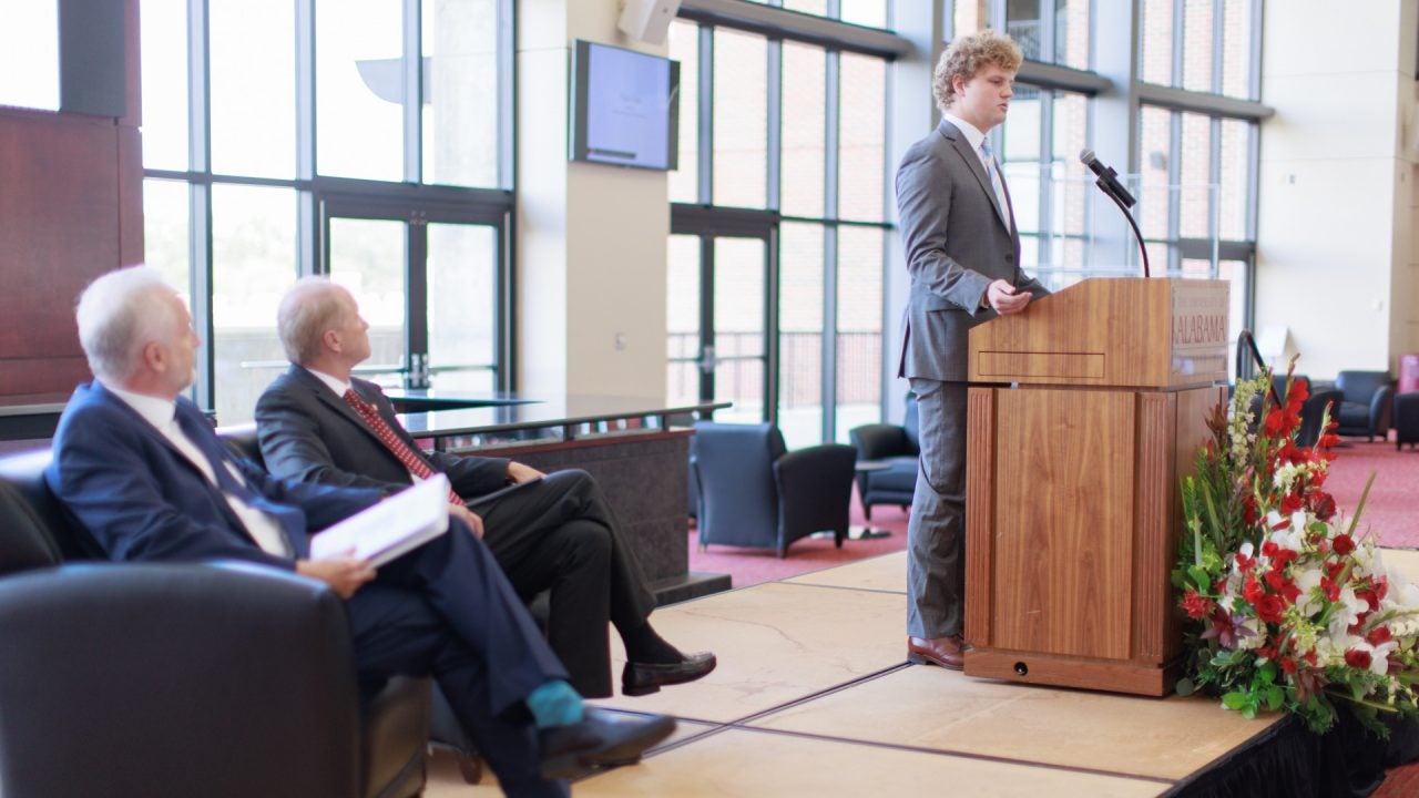 SGA president collier dobbs speaking at the podium