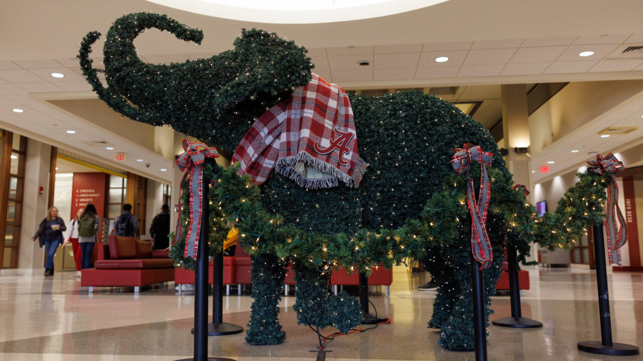 topiary elephant wearing a scarf