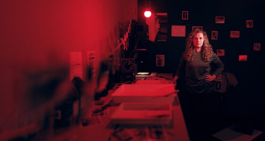 Student in a photography darkroom