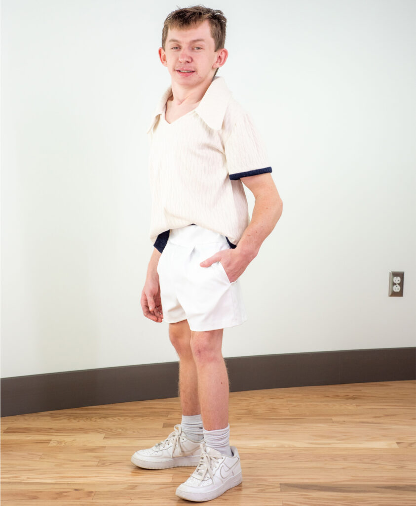 An adapted athlete modeling his custom outfit