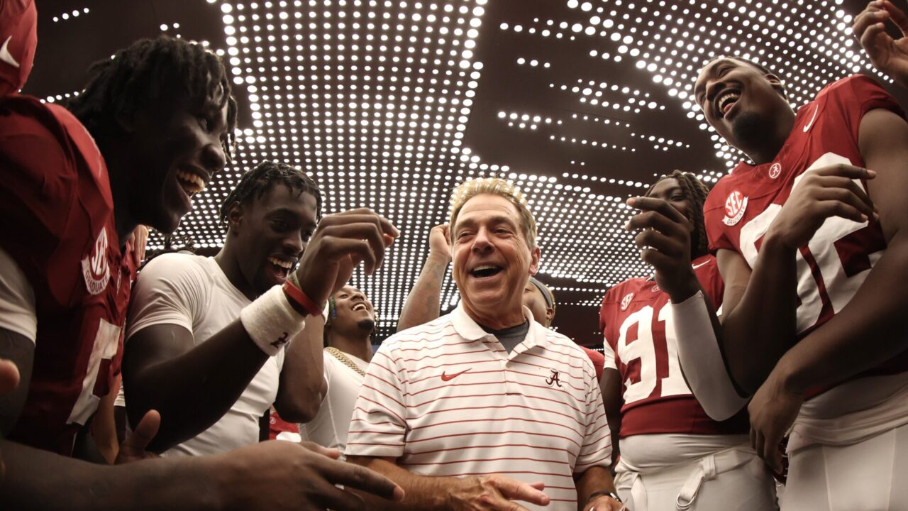 Saban is surrounded by players